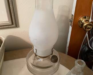 clear glass oil lamp