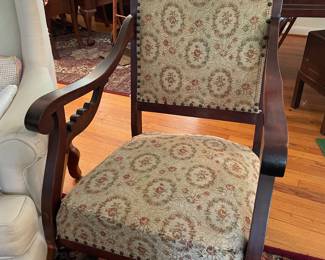 Antique upholstered rocking chair 