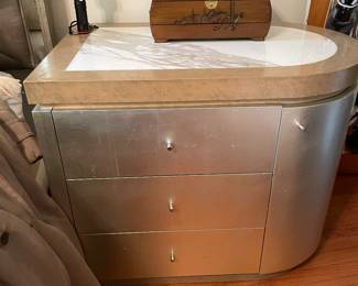 Rounded silver night stands 