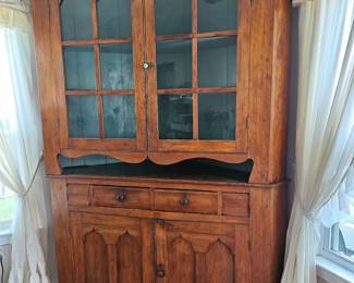 Magnificent hand-crafted cherry corner cupboard.