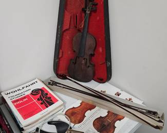 Old violin and 4 bows plus replacement parts and music.