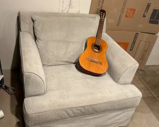 Club chair and jr guitar 
Rug