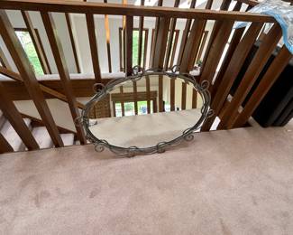 Oval mirror with metal frame