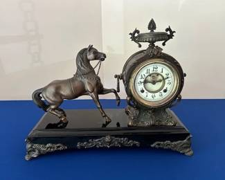 Antique clock with horse figure