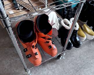 ski boots and assorted shoes and inline skates