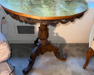 Tilt top, and laid Italian carved table