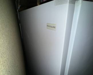 Frigidaire refrigerator in basement 