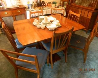 mid-century dining room table with chairs