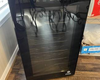Wine refrigerator - plugged in and cool, waiting for you to fill it!  