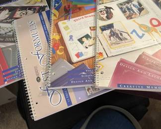 Creative Memories scrapbooks (10), pages, idea books paper cutters, and a sticker machine just waiting to be unleashed on your creativity.