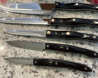 Cutco set.  Block included along with a cutting board.