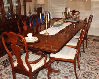 8'4" double-pedestal dining table and 8 Broyhill chairs; Shown with two 18" leaves, solid wood, beautiful.