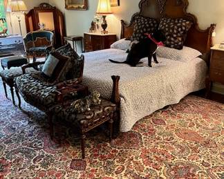 Elegant Bed & Luxurious Rugs