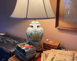 Vintage ceramic lamp, vintage books and newspapers