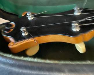 The headstock showing the tuning pegs for the guitar