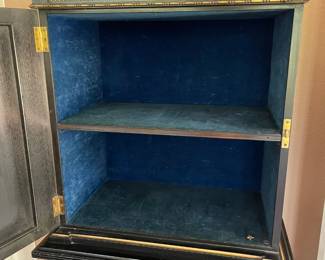 The inside of the cabinet, velvet lined