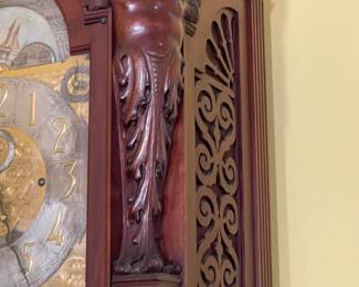 The angel details on either side of the clock face