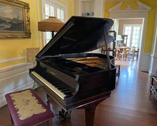 Another view of the piano and the needlepoint stool