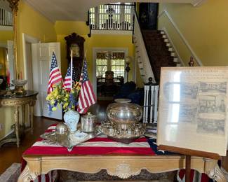 The entrance hall table contains, a silver plate punch bowl with 12 cups and ladle. Silver Plate biscuit barrel and Limoges vase and dish.