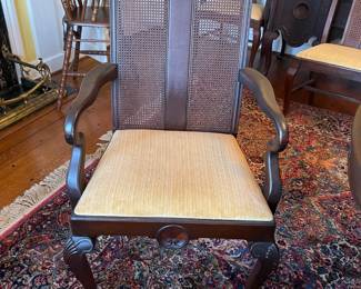 Set of 6 mahogany dining chairs with caned backs and wood panel in the center. Silk brocade upholstered seats and 2 host chairs.