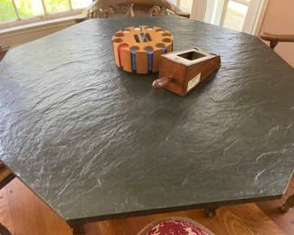 The top of the game table looks like slate, but in fact is a faux surface