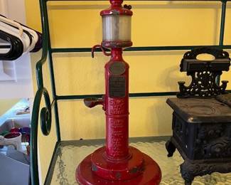 Vintage Serv-A-Liter vending machine was produced by Serv-a-Liter Co. (oddly enough) in 1928. Back in the day, for a penny, you could fill your Zippo Lighter from this pump.