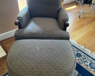 Upholstered arm chair with footstool.