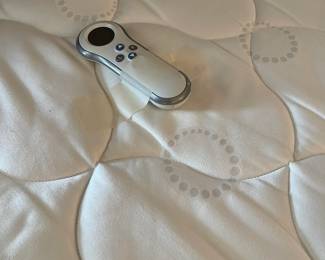 The mattress showing the remote control