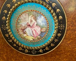The French Sevres insets are different on each cabinet door