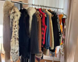 Wonderful ladies clothing, Koslow fur jacket, leather/fur reversible vest, suede jacket, full length wool coat with fur collar made by Christian Dior, more vests and hand made vintage aprons