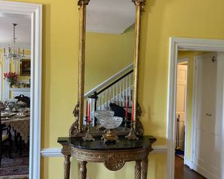 Looking at the Chippendale mirror and the antique console table, gold leaf with black marble top 19" x 45" 36" Circa 1800.