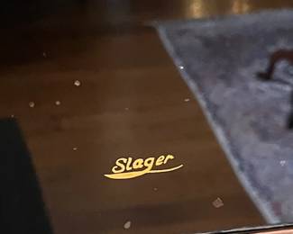 We assume this is the sign painter's signature.