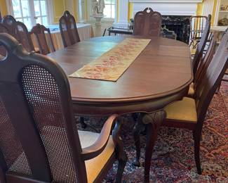All the dining room furniture is original to the house with the exception of the silver ware chest! The dining table is mahogany, oval and measures 54" x 54" with 4, 11" leaves.