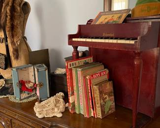 Vintage children's books, vintage toy piano, vintage small doll dresser