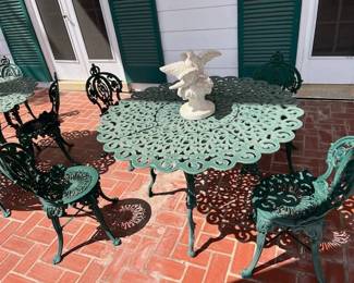 A close look at one of two tables, great scalloped and swirl details