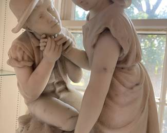A close look at the double figure marble statue by Millet