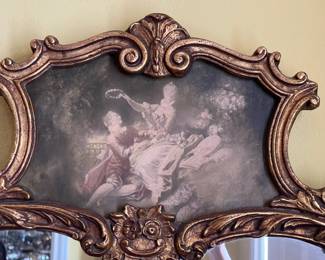 The painted top panel of the mirror in the entrance hall