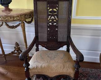 Occasional chair with caned back, center carved panels and silk upholstered seat. We have two of these chairs