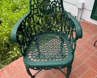 We have 2 of these vintage lyre back heavy metal chair.