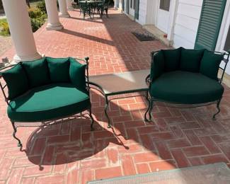 Vintage iron outdoor furniture with cushions, fitted shaped table