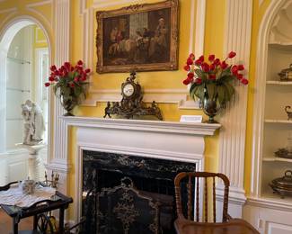 Looking at the mantle showing the Antique French clock with ornate brass mounting 24 1/2" x 18 1/2" and two Georgian Old Sheffield wine coolers with shell, gadroon and fluting designs, with crest circa 1800's
