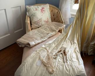 French Provincial chaise lounge with cream damask upholstery, the train of the vintage wedding dress is covering part of the chaise!