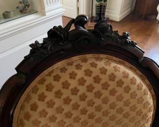 Wood carved details at the top of the rosewood fainting couch. This piece matches the sofa and two chairs