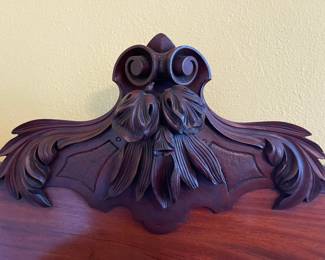 Top ornamentation of the burlwood credenza