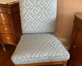 Antique heavily carved arm less chair with blue silk brocade seat and back upholstery