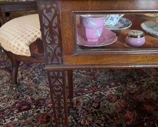 Carved details of the mahogany display case