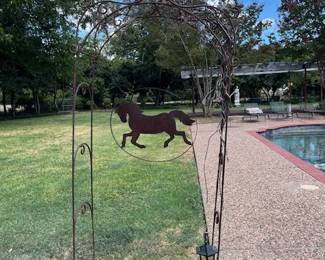 Iron arch with hanging horse