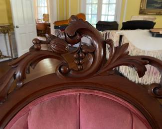 The top carved details of the Mr. and Mrs Victorian chairs