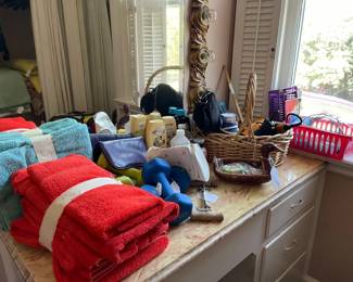 Towels, bathroom lotions and potions, hair items, hand weights