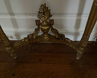 Wonderful carved details on the stretcher of the console tables